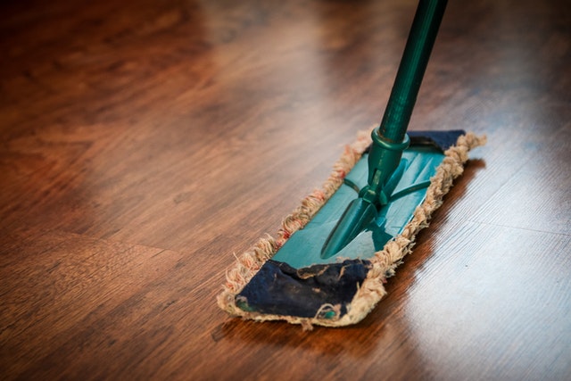 cleaning floor with mop